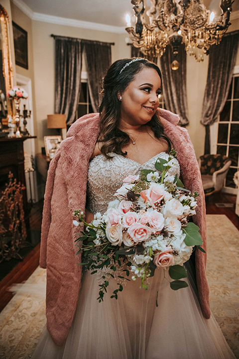 Fete-Venue-New-Orleans-Wedding-bride-with-fur-jacket-bride-in-a-strapless-ball-gown-with-a-pink-fur-shawl