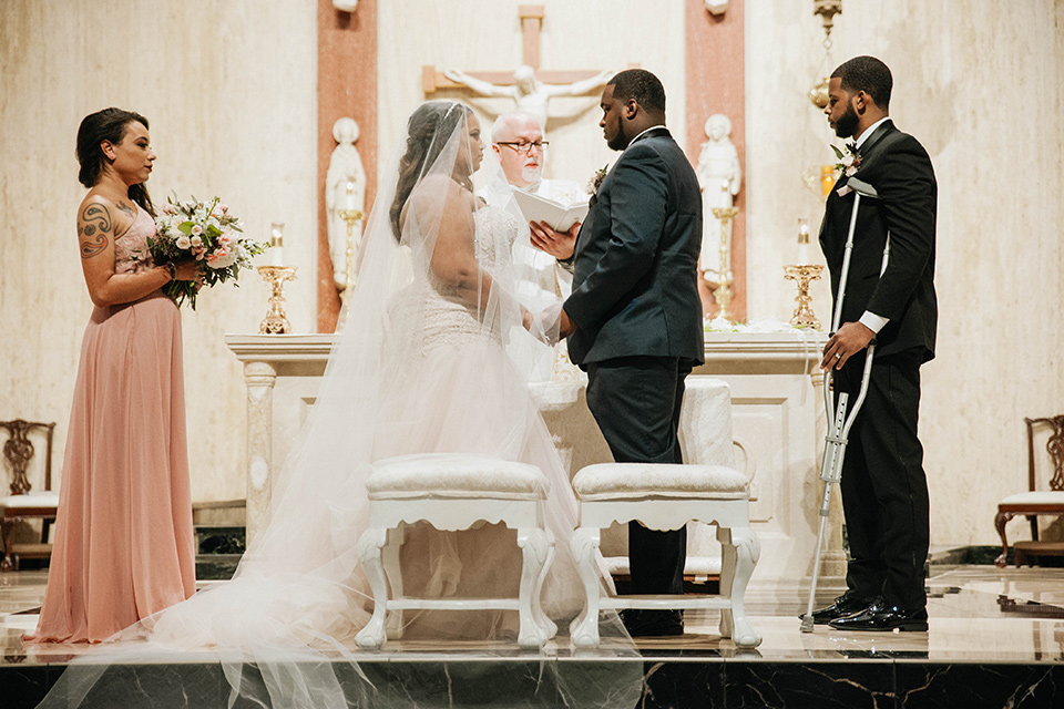 Fete-Venue-New-Orleans-Wedding-ceremony-bride-in-a-tulle-strapless-ballgown-groom-in-a-navy-blue-tuxedo