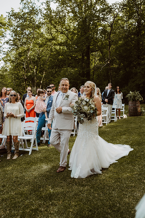 Horse-Range-Vista-bride-walking-down-the-aisle-in-a-lace-strapless-mermaid-gown