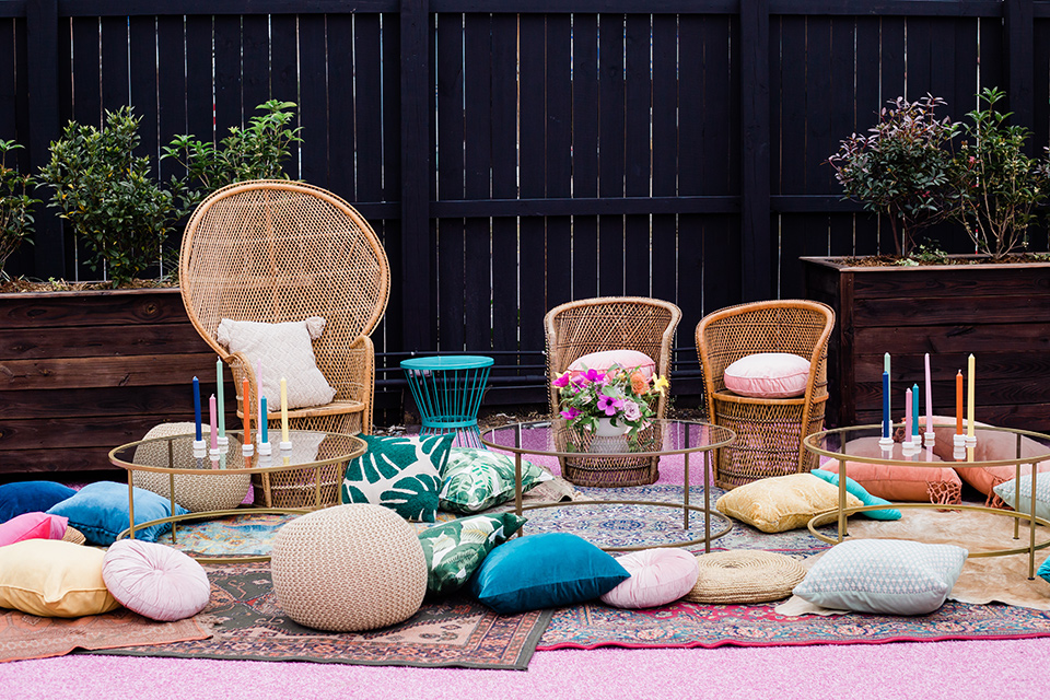 outdoor bohemian furniture with multicolored pillows everywhere