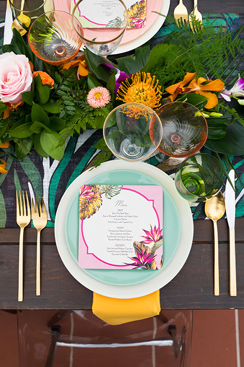 Ole-Hanson-Beach-Club-flatware-with-gold-flatware-and-colorful-plates-and-linens-in-teal-orange-and-pink