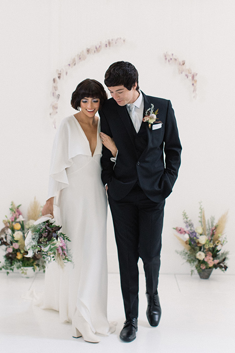 Modern-Mystical-Styled-shoot-at-the-york-bride-and-groom-walking-after-ceremony-bride-in-a-flowing-sheer-dress-with-a-silk-underlay-groom-in-a-black-suit