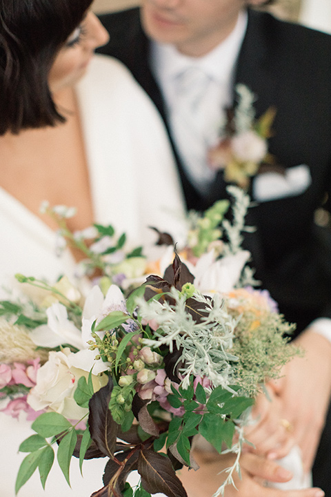 Modern-Mystical-Styled-shoot-at-the-york-close-up-on-the-bride-and-groom-bride-in-a-white-dress-groom-in-ablack-suit