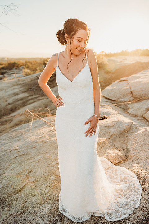 Moonflower-Ranch-Shoot-bride-alone-lace-form-fitting-gown-with-straps-and-v-neck-line