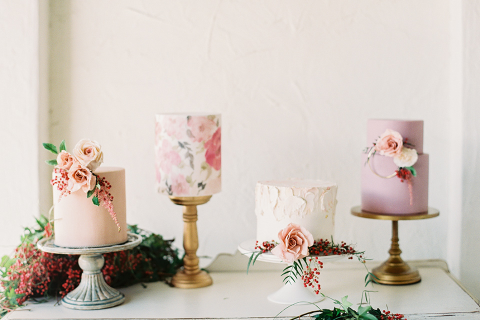 II-Mercato-in-New-Orleans-cakes-on-tables-one-tiered-cake-with-astel-colored-and-hand-painted-flowers