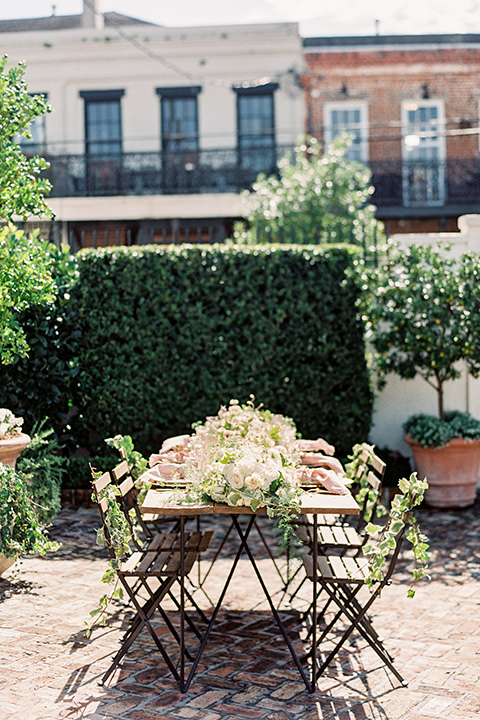 II-Mercato-in-New-Orleans-table-outside-long-wooden-table-with-iron-detailed-chairs