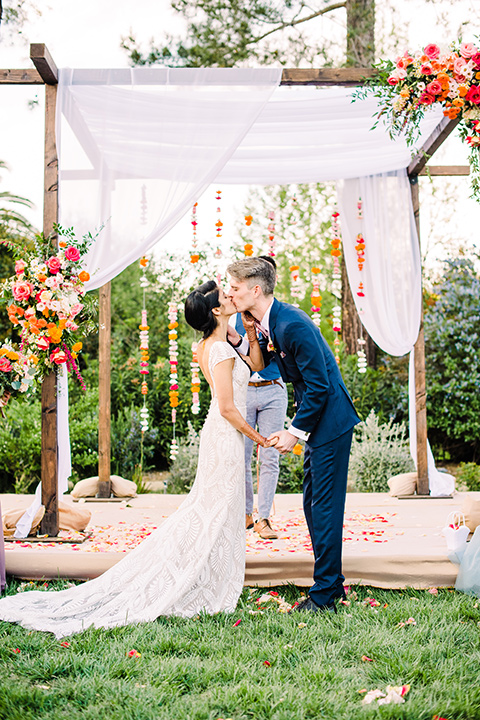 Supriya-and-Chris-wedding-bride-and-groom-first-kiss