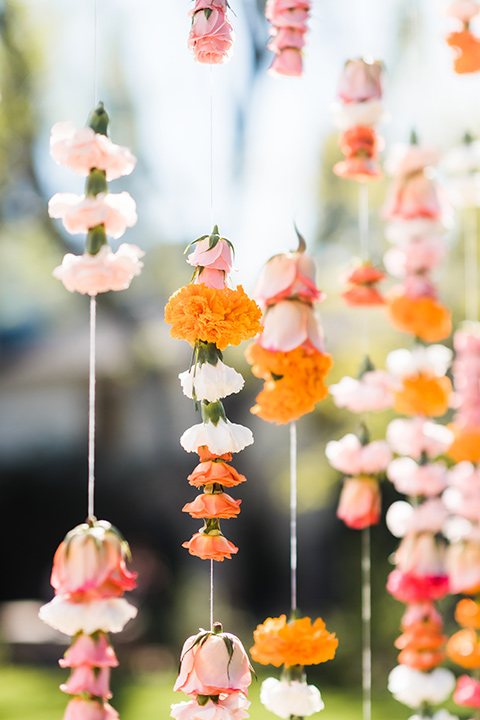 Supriya-and-Chris-wedding-hanging-flowers-on-ceremony-arch