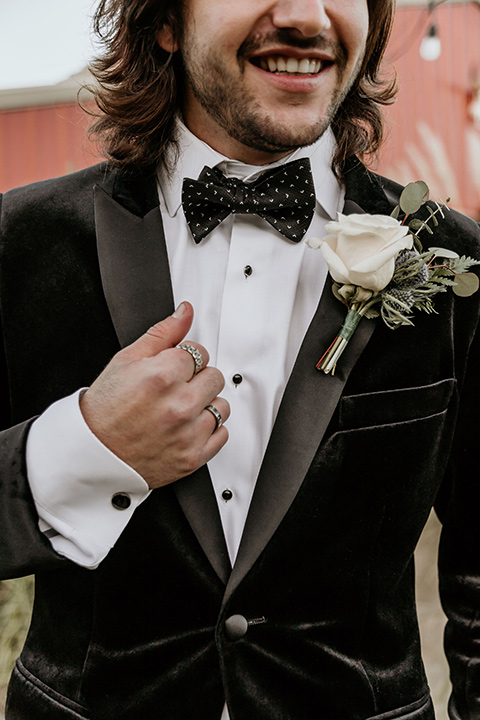 The-Retro-Ranch-Shoot-groom-attire-close-up-groom-in-a-black-velvet-coat-with-light-grey-pants