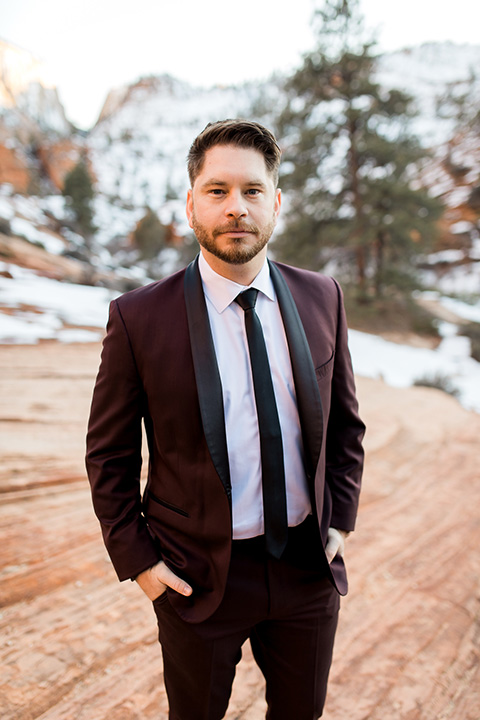 Utah-Shoot-groom-in-a-burgundy-jacket-with-a-black-long-tie