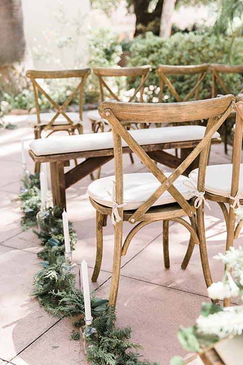 Maxwell-House-wood-chairs-with-greenery-and-white-cushions