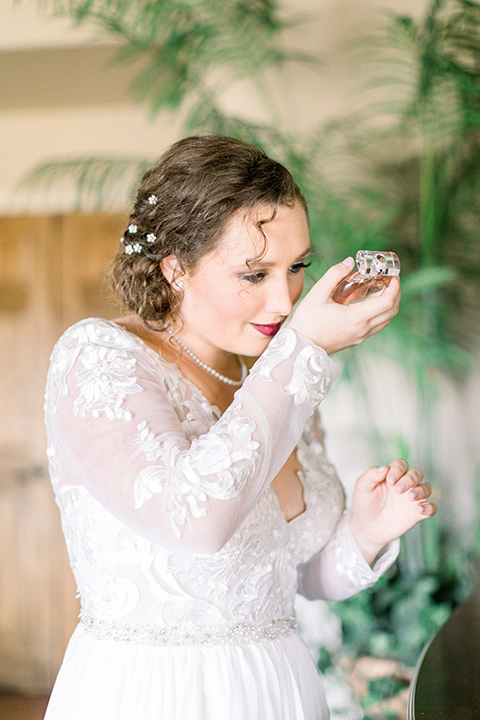 community-church-wedding-bride-and-perfume-bride-in-a-flowing-gown-with-long-sleeves-and-an-illusion-bodice