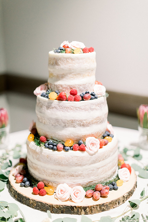 community-church-wedding-cake-with-white-fondant-and-fresh-berries