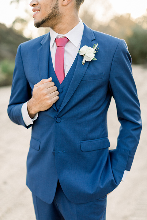 community-church-wedding-close-up-on-groom-groom-in-a-royal-blue-suit-with-berry-tie