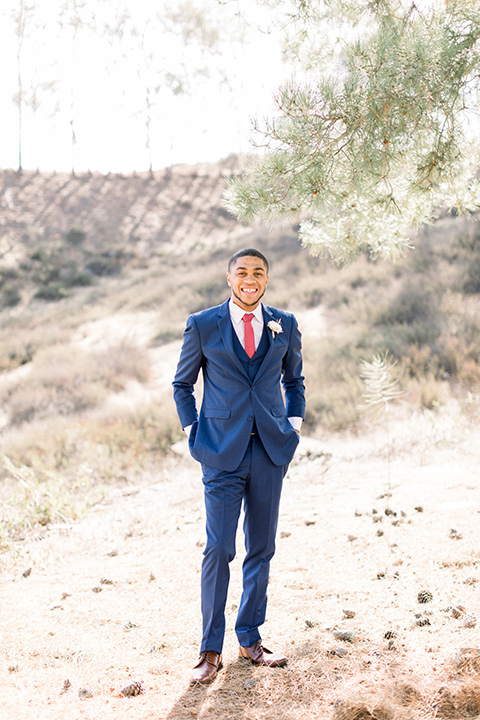 community-church-wedding-groom-smiling-at-camera-in-a-cobalt-blue-suit-with-a-berry-colored-tie