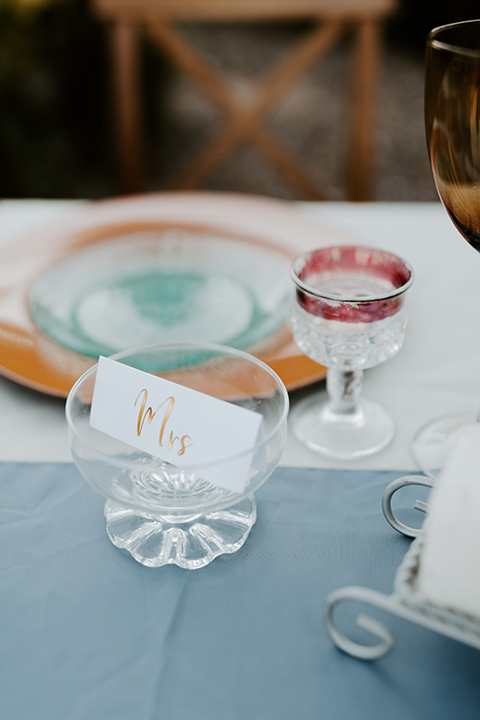  white and blue table décor wit orange and white décor and styling