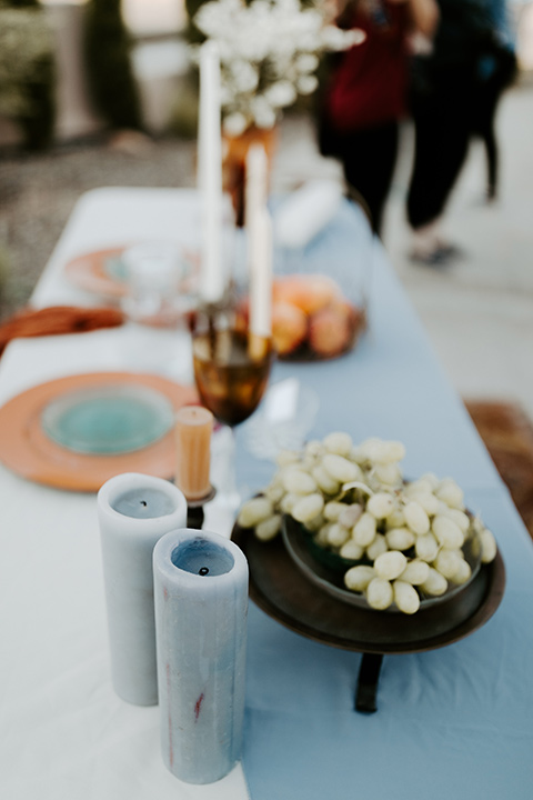  white and blue table décor wit orange and white décor and styling 