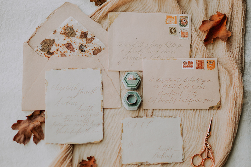  invitations with gold and orange calligraphy