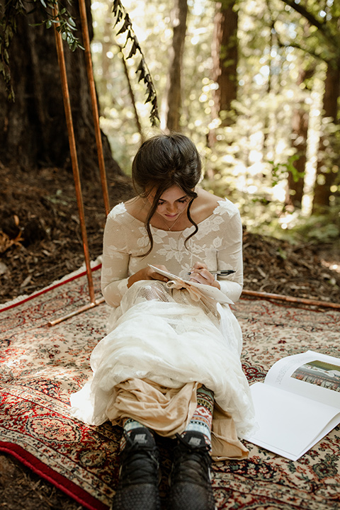  formfitting bridal lace gown with sleeves and the groom in a caramel suit with long tie