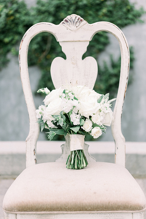white and green florals on a white chair