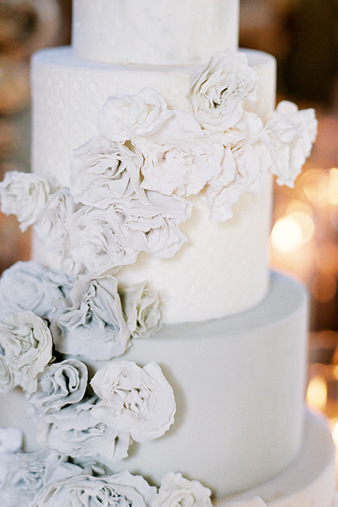  white tired cake with white flowers 