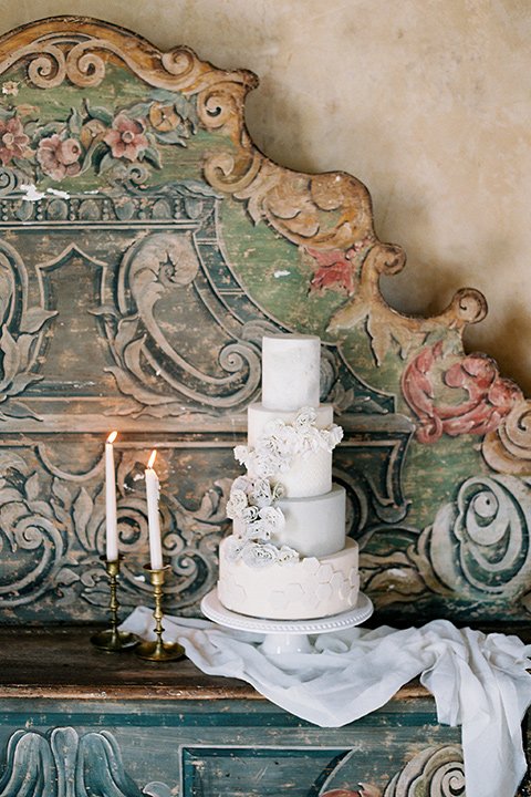  white tired cake with white flowers 