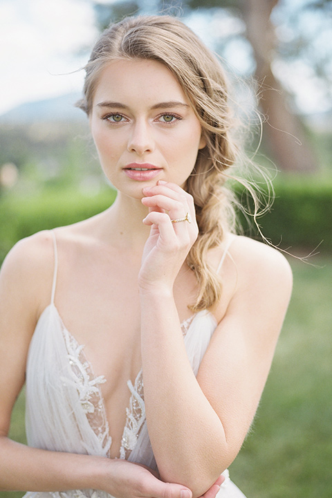  bride in a white flowing gown with a v neckline 