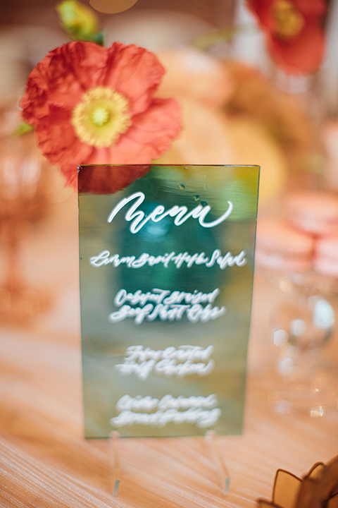  peach and gold table scape décor with blue glass menus 