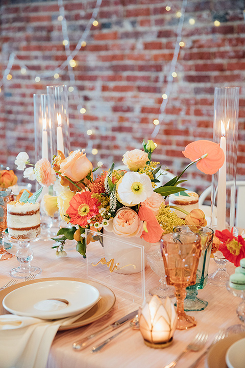  peach and gold table scape décor with blue glass menus 