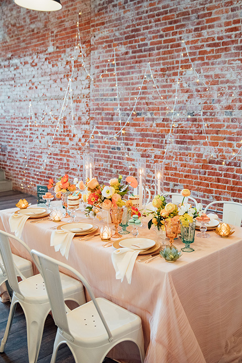 peach and gold table scape décor with blue glass menus 