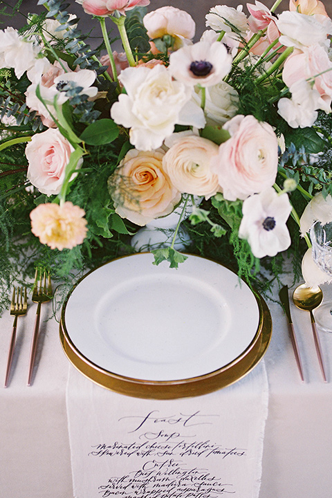  white plates with gold flatware 