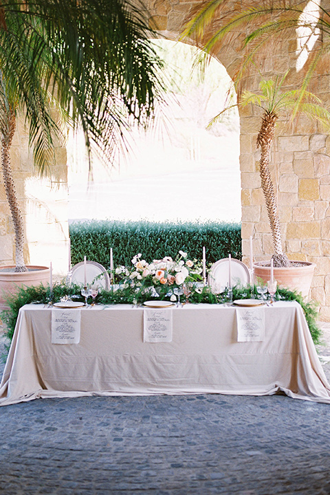  cream table linens and green florals