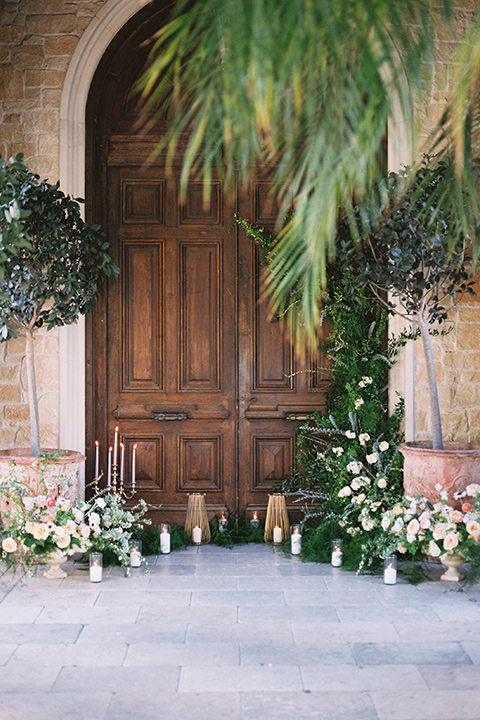  ceremony space in front of old wooden doors 