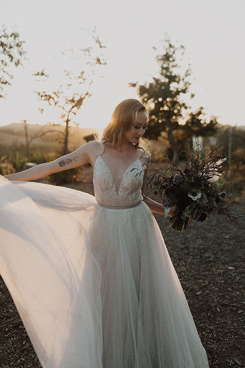  bride in a tulle a line gown with a sweetheart neckline and a crystal bodice 