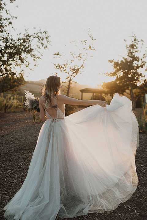  bride in a tulle a line gown with a sweetheart neckline and a crystal bodice