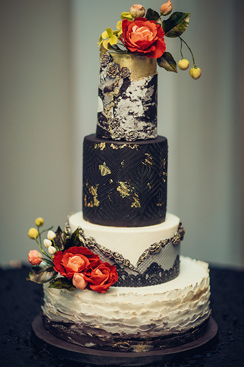  black and silver cake with red flowers