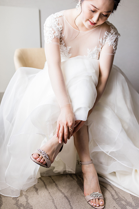  bride putting on her shoes