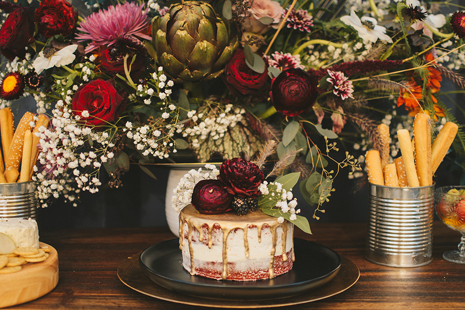  bohemian wooden table with big full flower décor with burgundy details