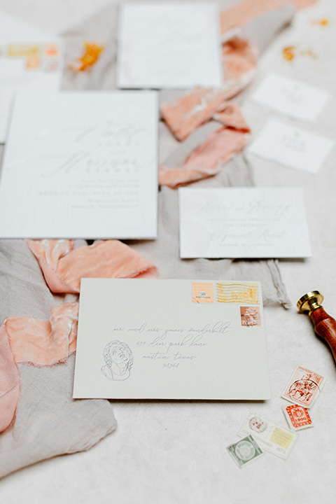  white invitations with light blush pink floral design