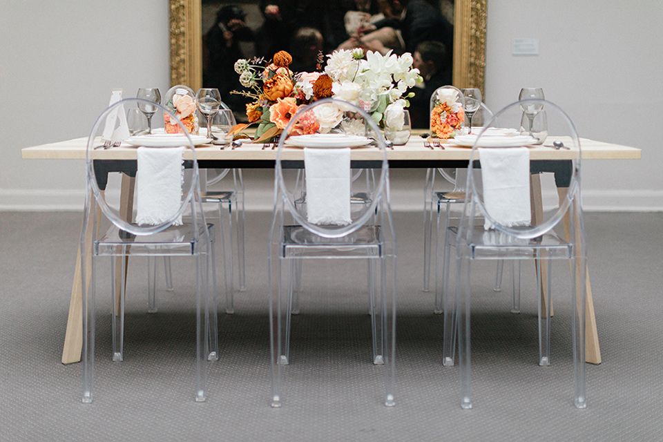  light wash furniture with clear chairs and simple white linens