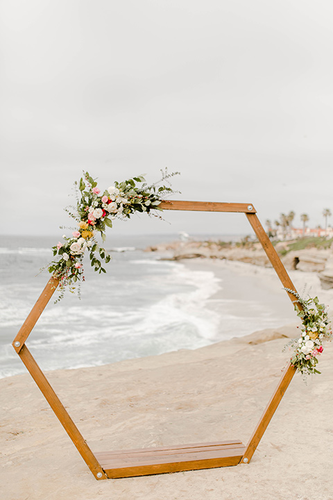  geometric ceremony arch with pink and green florals