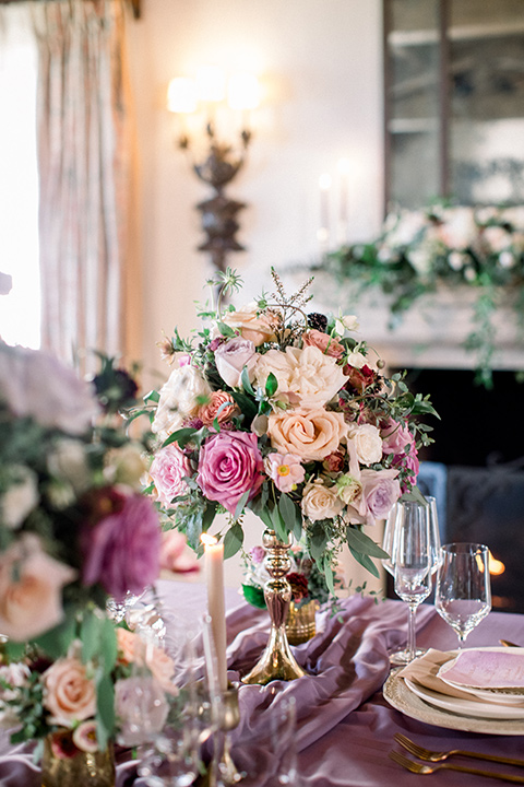  table décor with abundant florals and purple linens