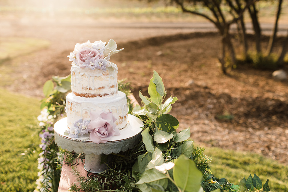  white cake with purple flower details