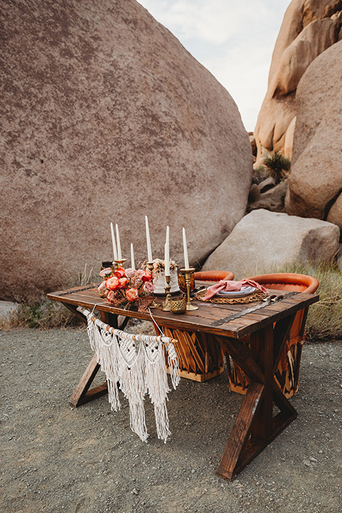  bohemian sweetheart table set up with wood table and macrame 