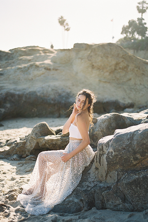   bride in  flowing gown with embellishments 