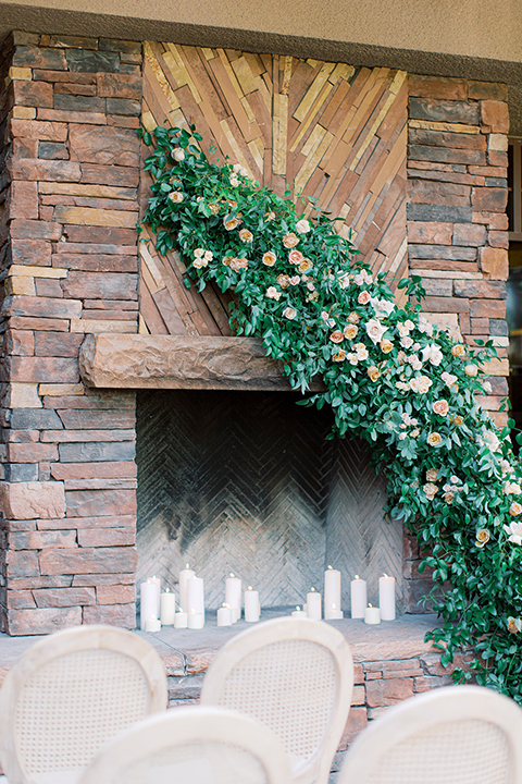  red rocks caramel wedding couple sitting – bride in a strapless modern gown and the groom in a caramel tan suit with a chocolate brown tie 