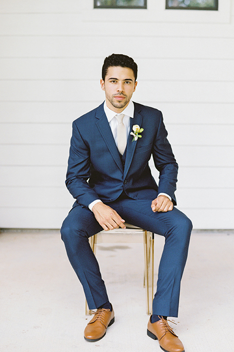  ruffled shoot in texas – bride in a romantic casual wrap dress and the groom in a blue suit with a white long tie