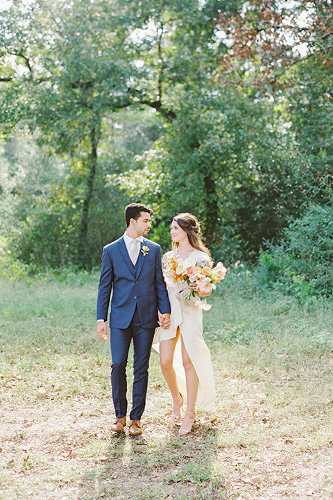  ruffled shoot in texas – bride in a romantic casual wrap dress and the groom in a white long tie