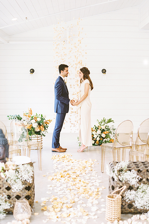  ruffled shoot in texas – bride in a romantic casual wrap dress and the groom in a white long tie