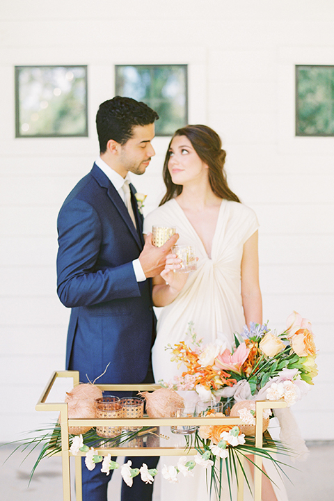  ruffled shoot in texas – bride in a romantic casual wrap dress and the groom in a white long tie